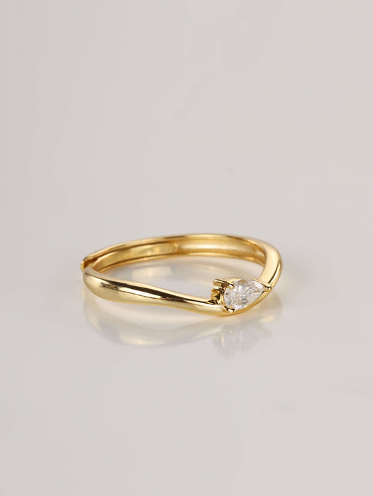A modern 925 sterling silver wavy stacking ring featuring a 0.5ct pear-cut moissanite centre stone.