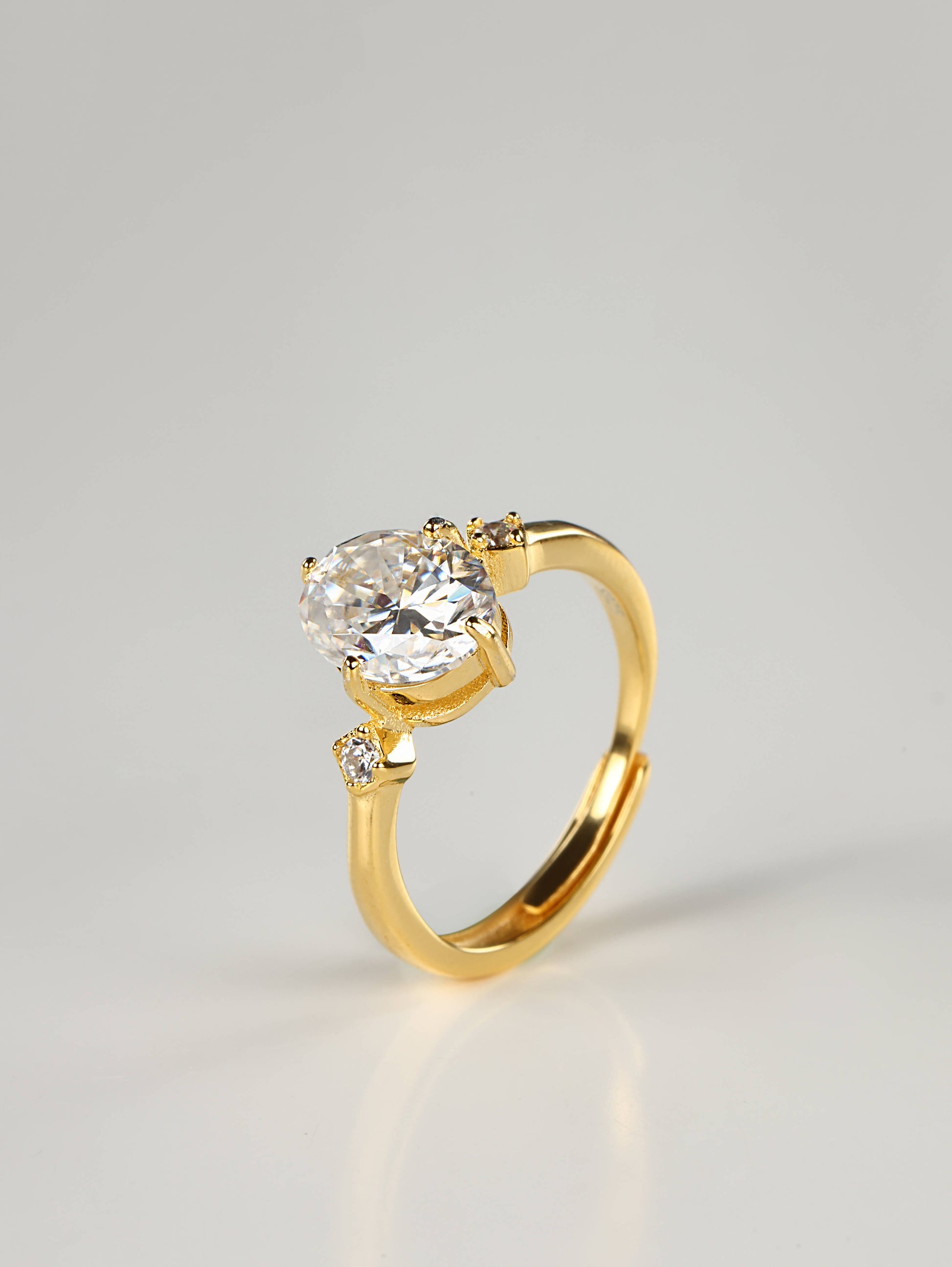 Close up of an elongated 2 carat oval moissanite adjustable ring worn as a statement piece
