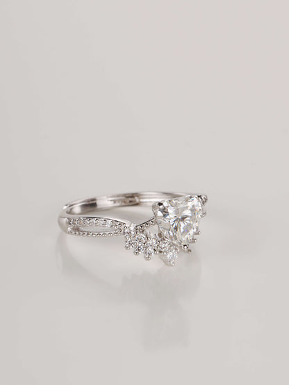 Close up of a woman wearing a 1 carat heart moissanite promise ring on her ring finger
