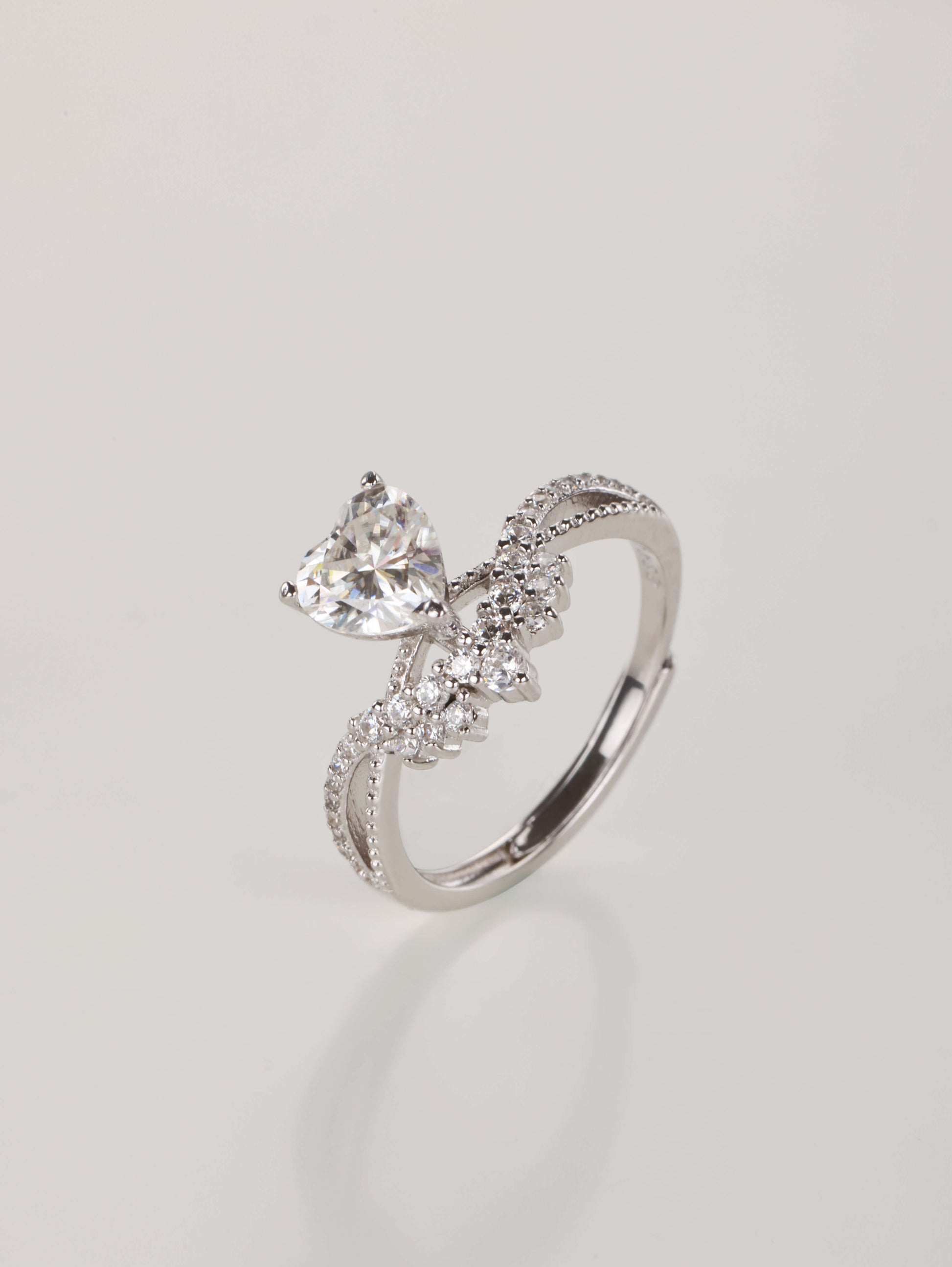Sparkling 1 carat heart cut moissanite diamond alternative ring catching the light
