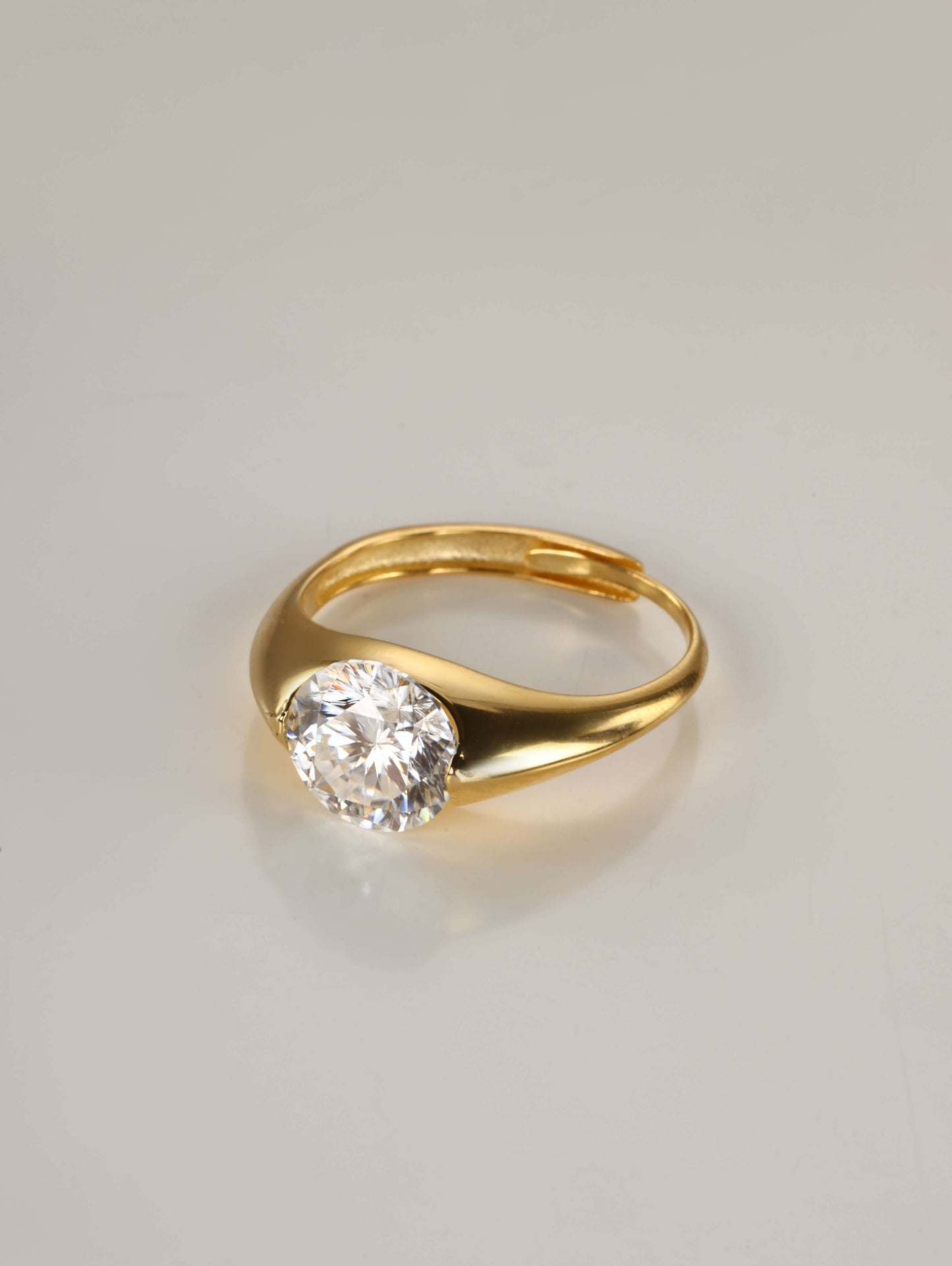 A sleek 925 sterling silver adjustable dome ring showcasing a brilliant 2-carat round moissanite centre stone in a modern sculptural band.