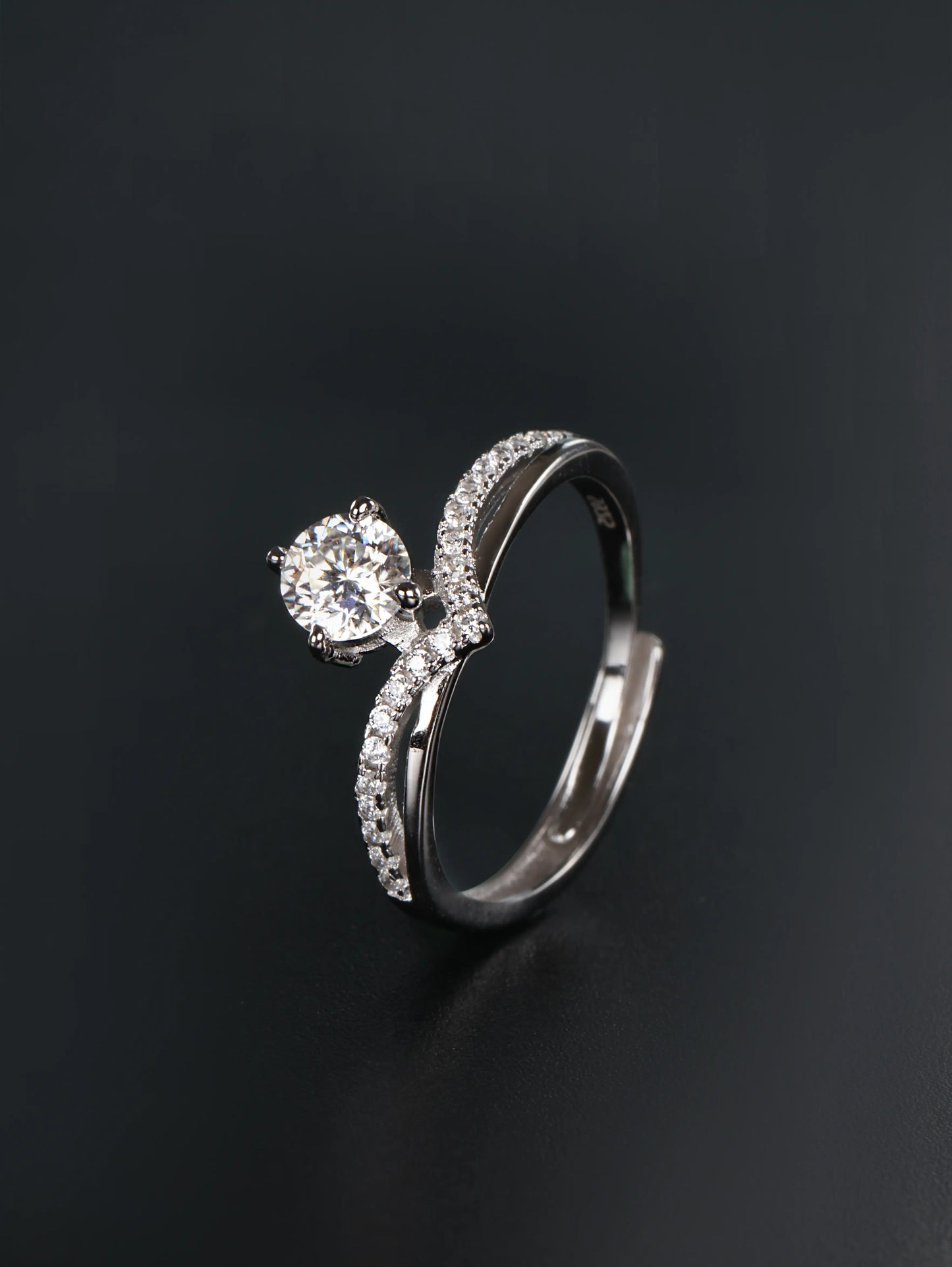 V-shaped sterling silver crown ring with 0.5ct round brilliant moissanite center stone chevron band