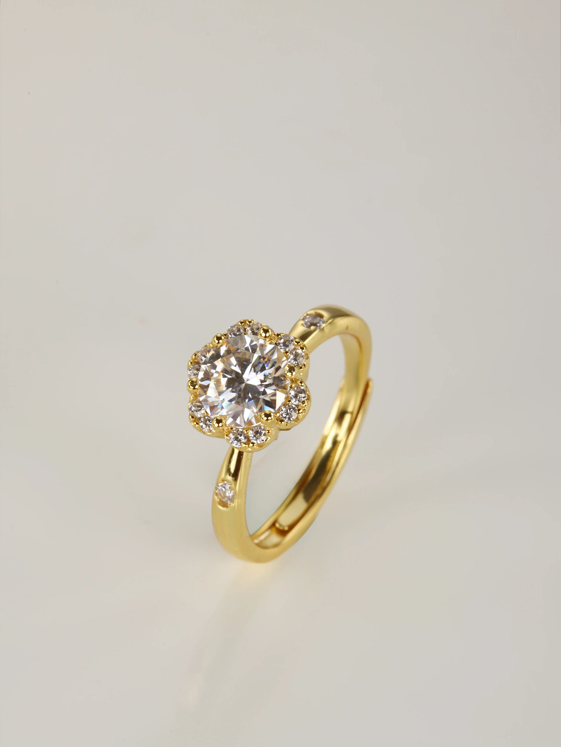 A close-up of a hand wearing the 1ct flower design moissanite ring, demonstrating the sparkling halo effect and everyday elegance in natural lighting.
