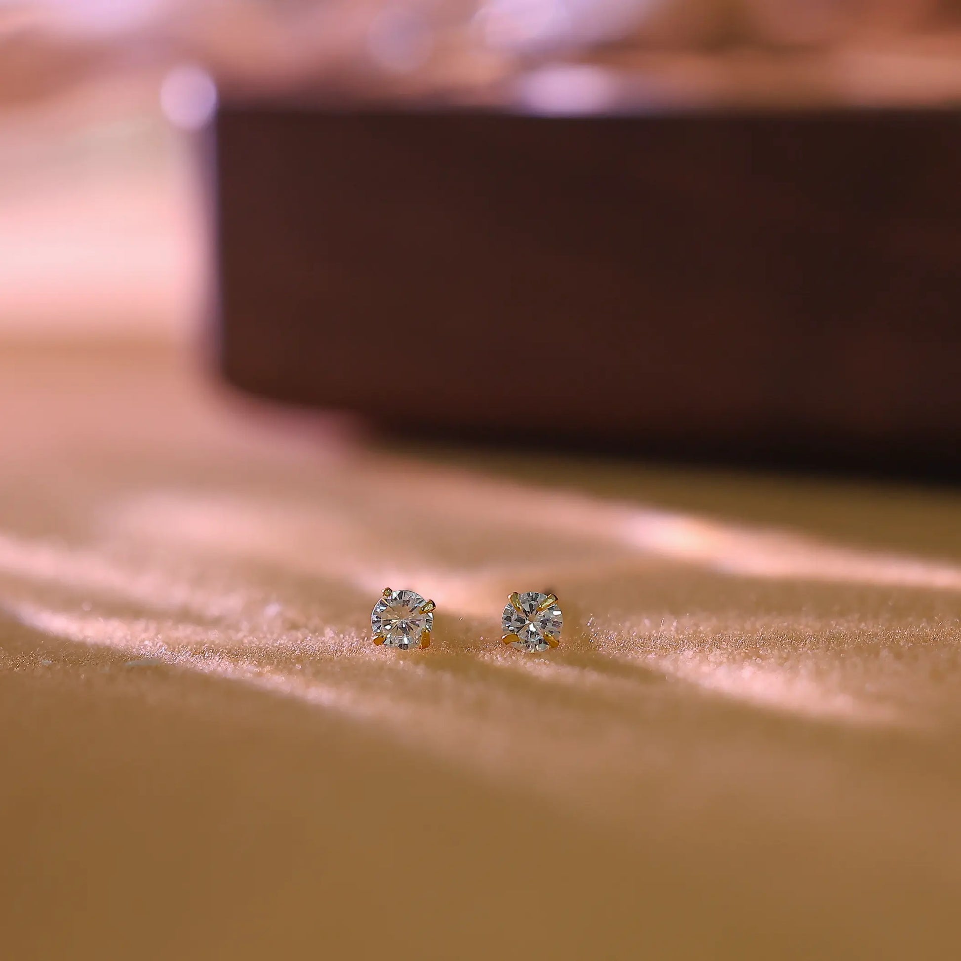 Macro shot of the round brilliant cut diamond simulant in a classic 4-prong setting.
