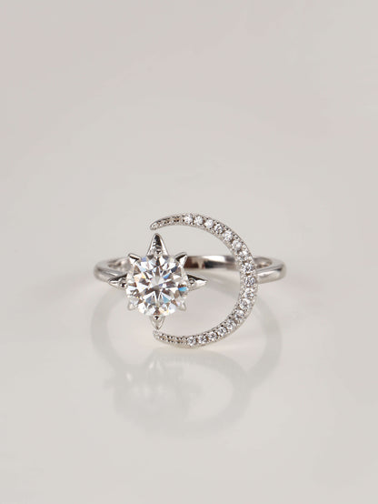 A 925 sterling silver adjustable ring featuring a 1-carat moissanite star and a pavé sparkling crescent moon, resting on a clean white background