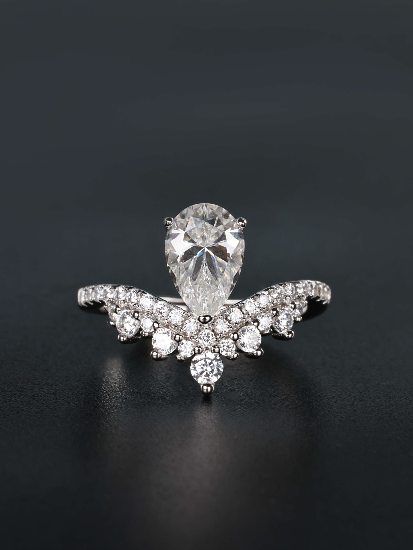 1.5ct pear cut moissanite ring with integrated v shaped scalloped tiara pavé crown band in silver