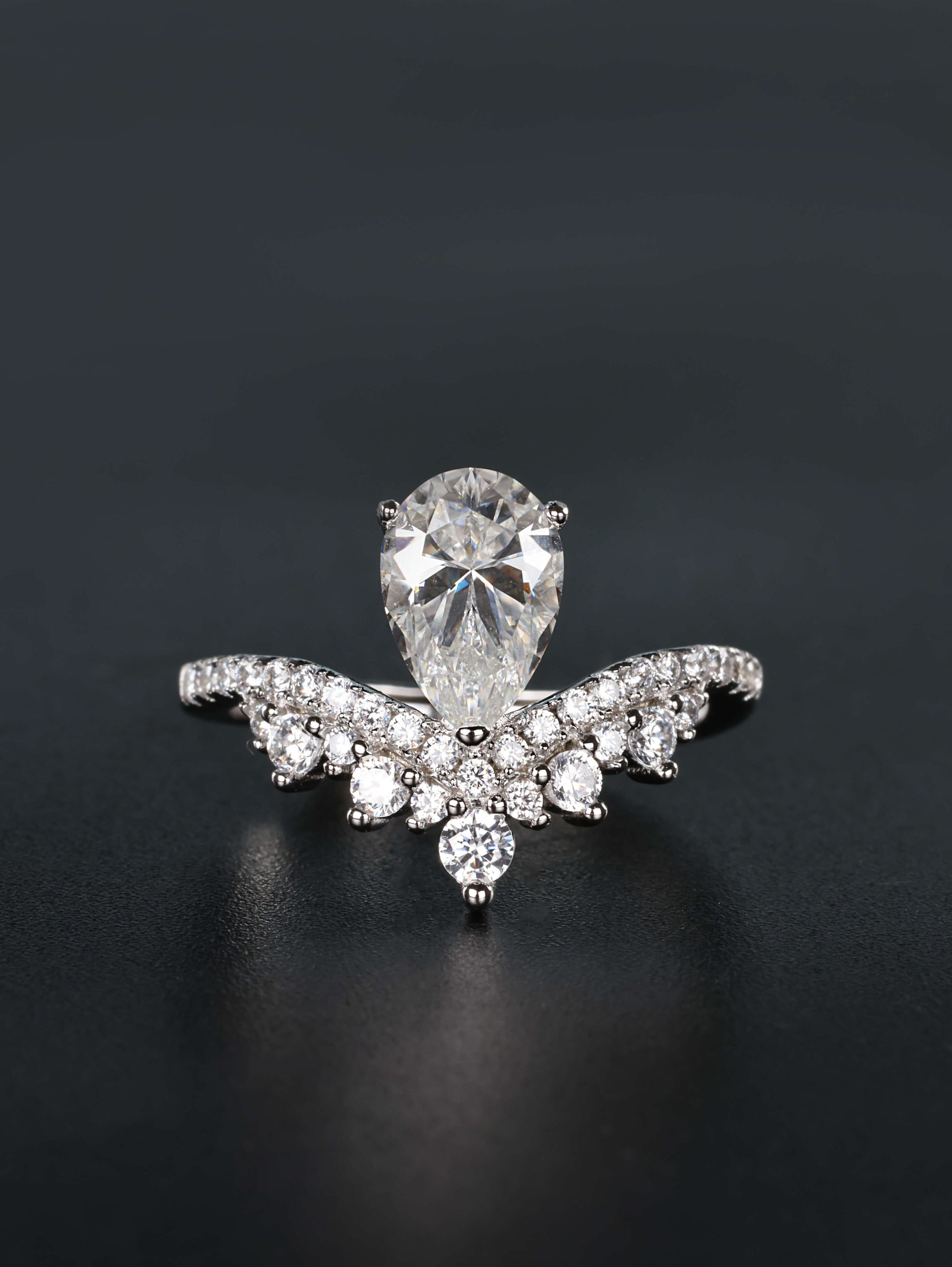 1.5ct pear cut moissanite ring with integrated v shaped scalloped tiara pavé crown band in silver