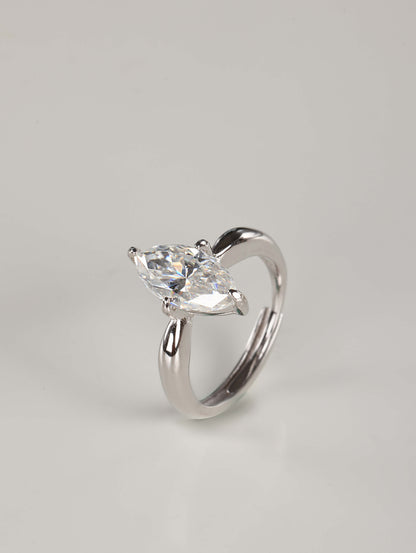 An elegant portrayal of a breathtaking 2-carat marquise moissanite ring, ideal as an alternative engagement or promise ring. Handcrafted in 925 silver with a brilliant-cut center stone and V-prongs, this statement solitaire rests on a neutral, professional studio backdrop.