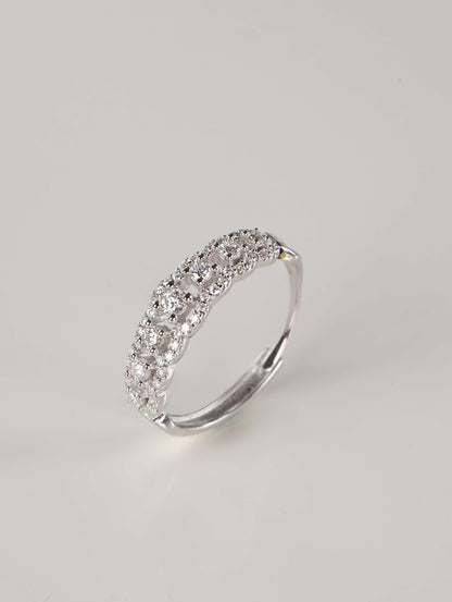 A side and back profile of an adjustable silver moissanite lace ring, revealing the discrete open-back band design. The front of the ring shows 0.41ct of brilliant stones set in a detailed, vintage-inspired scalloped pavé pattern.