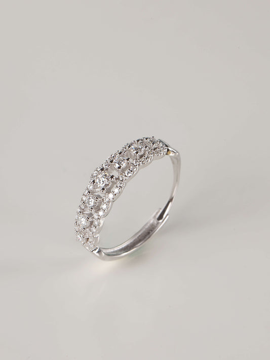A side and back profile of an adjustable silver moissanite lace ring, revealing the discrete open-back band design. The front of the ring shows 0.41ct of brilliant stones set in a detailed, vintage-inspired scalloped pavé pattern.
