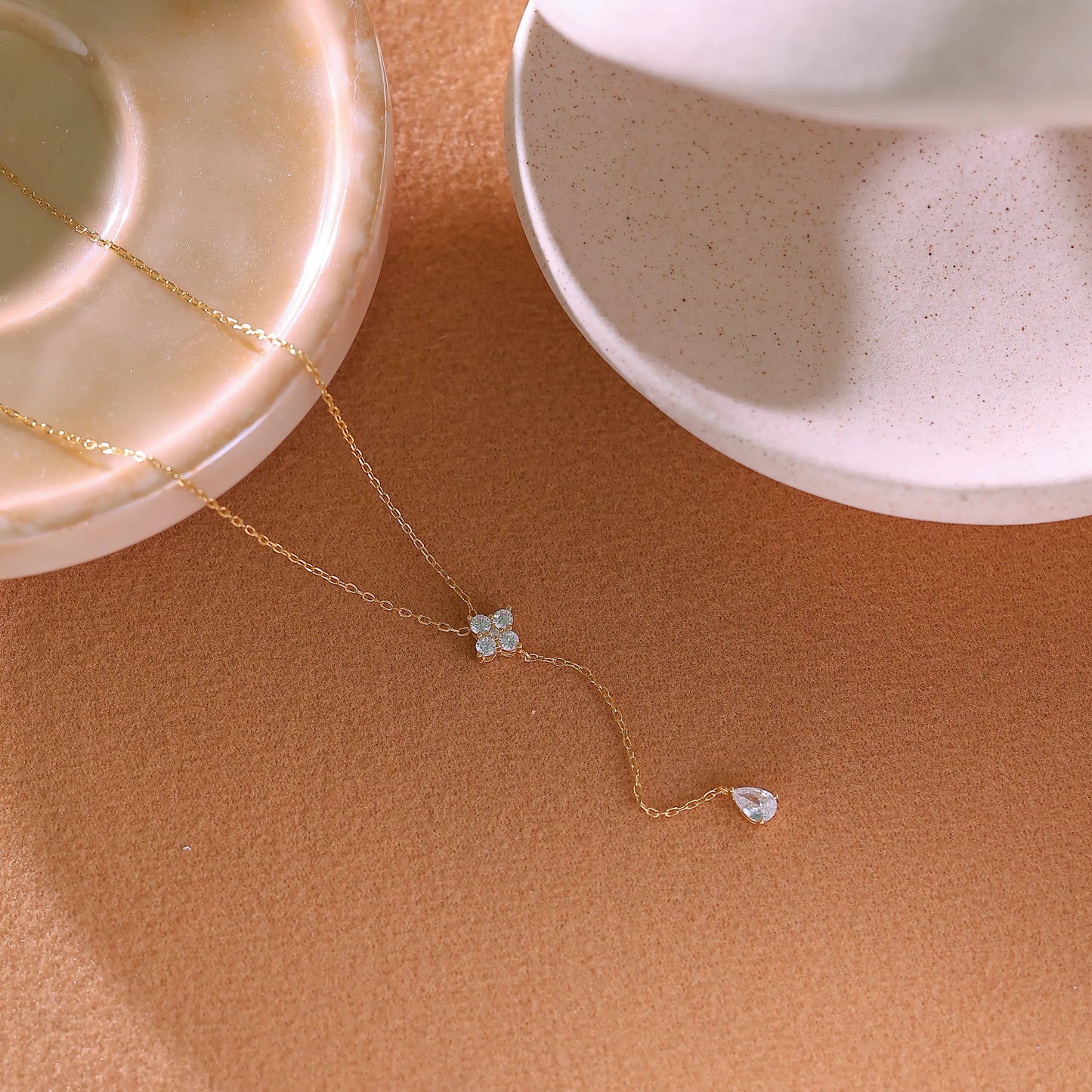 Detail of the 5cm vertical drop chain ending in a small solitaire diamond