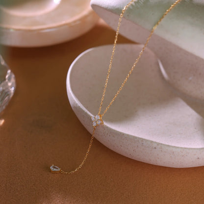 Gold lariat necklace laid flat showing 40cm chain length and adjustable extender