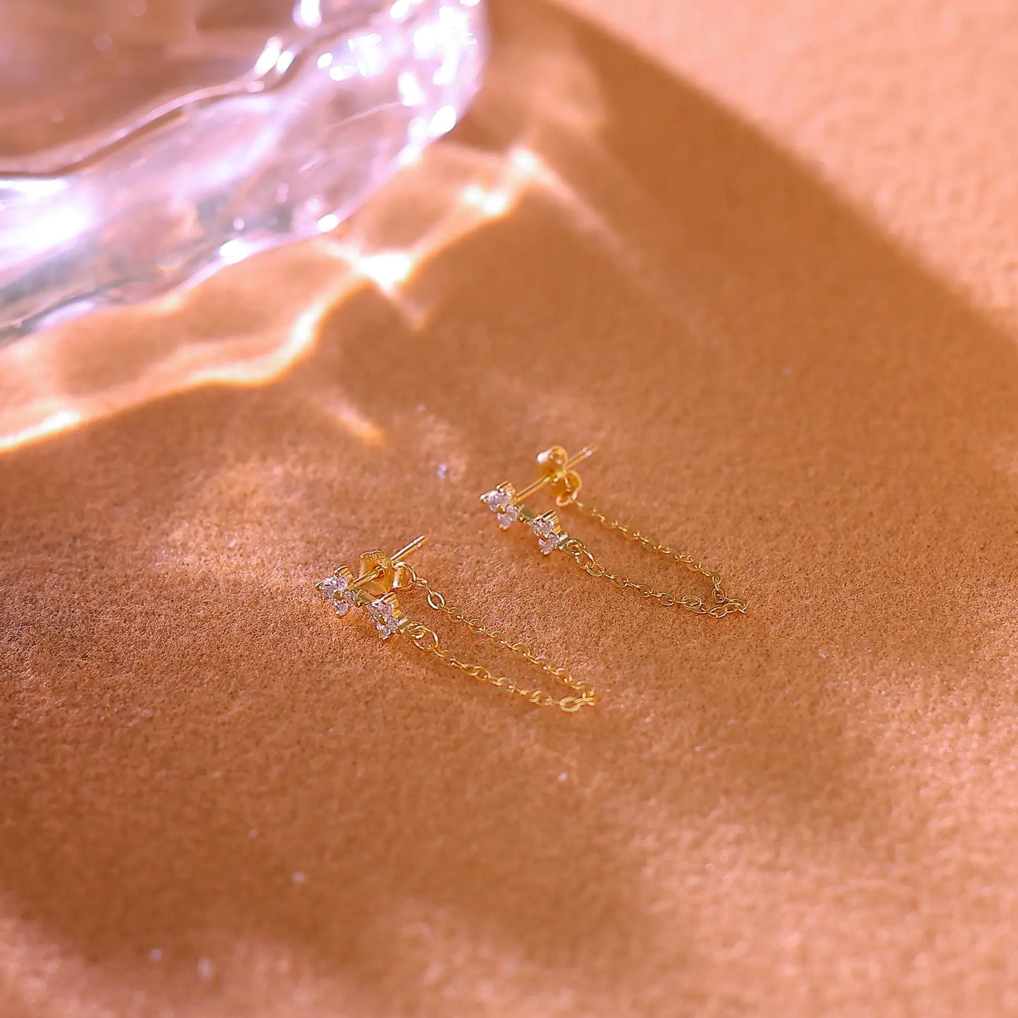 Macro shot of the cubic zirconia flower cluster setting on the earring post.