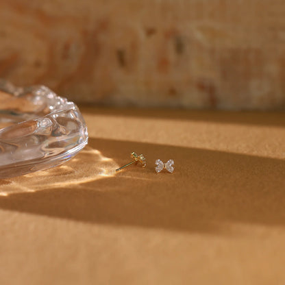 Back view of the gold vermeil bow stud earrings showing the secure push-back closures.