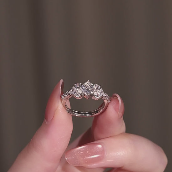 The geometric 1-carat square cut ring displayed elegantly next to its signature luxury gift box and protective microfibre pouch.